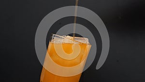 Pouring Fanta in Glass with ice