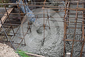 Pouring the foundation with a concrete pump