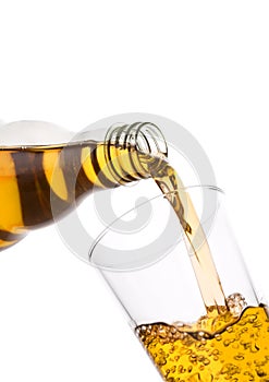 Pouring fresh apple juice from bottle to glass