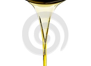 Pouring fresh automotive engine oil lubricating oil, yellow liquid oil into a motor car isolated on white background. Change new