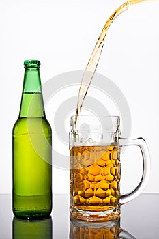 Pouring beer into mug