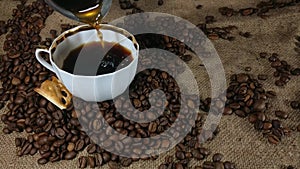 Pouring fresh brewed coffee into the coffee cup