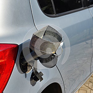 Pouring fuel into the car gas tank