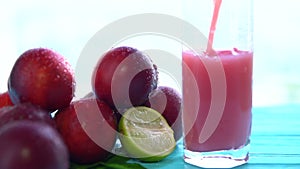 Pouring a glass of freshly liquidised fruit juice