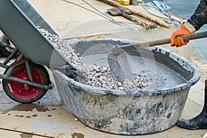 Pouring gravel from truck to concrete cement mixing