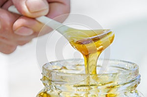 Pouring honey into the jar