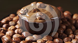 Pouring hot melted chocolate and almond nuts texture, close up, , 4k