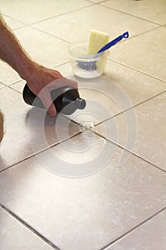 Pouring Hydrogen Peroxide on Floor Grout photo