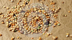 Pouring legumes on crumpled paper