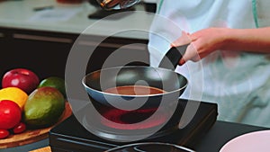 Pouring the liquid chocolate dough into the pan