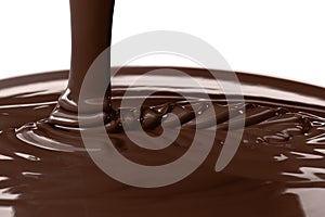 Pouring liquid hot chocolate closeup. Cooking dessert.