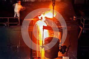 Pouring of liquid metal in open hearth workshop