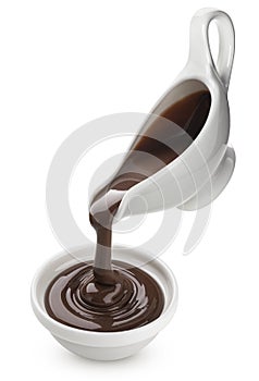 Pouring melted chocolate isolated on white background