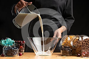 Pouring milk into the breakfast, freezing in motion. Cooking breakfast cereals, granules, breakfast cereals, cereals, berries of