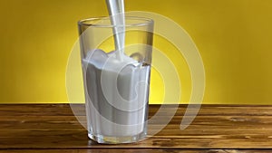 Pouring milk from jug to glass on a rustic wooden table