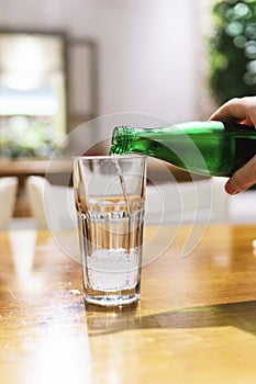 Pouring mineral water into the glass