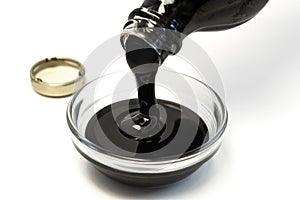 Pouring Molasses in an Ingredient Bowl