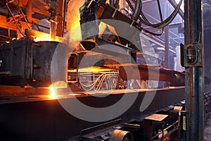 Pouring of molten iron in foundry