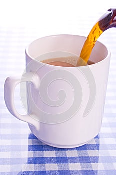 Pouring mug of tea