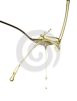 Pouring oil splash. Isolated on white background.