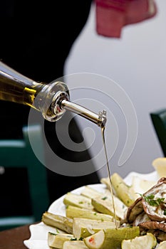 Pouring olive oil