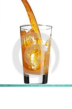 Pouring an orange beverage