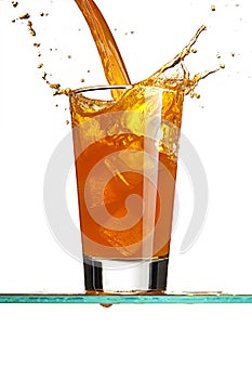 Pouring a orange beverage