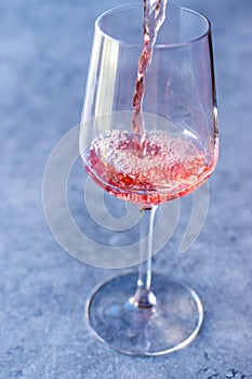 Pouring Pink Rose Blush Wine to Glass