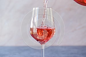Pouring Pink Rose Blush Wine to Glass
