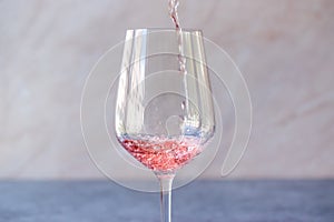 Pouring Pink Rose Blush Wine to Glass