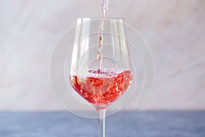 Pouring Pink Rose Blush Wine to Glass