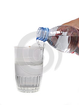 Pouring purified fresh drink water from the bottle