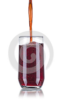 Pouring Red Beverage in a Glass