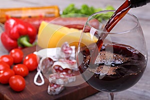 Pouring red wine and food bachground