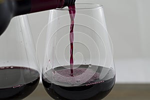 Pouring red wine into the glass