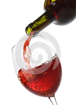 Pouring red wine into a glass