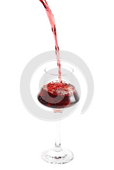 pouring red wine in glass on white background