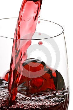 Pouring Red Wine Isolated on White