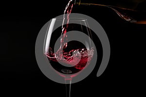 Pouring red wine to glass party restaurant bar gourmet celebration luxury taste splashing grape alcohol expensive drink