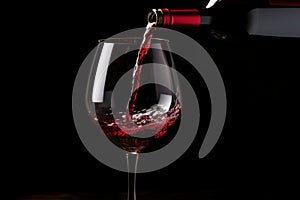 Pouring red wine to glass party restaurant bar gourmet celebration luxury taste splashing grape alcohol expensive drink