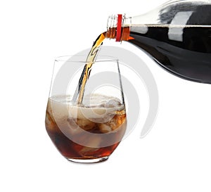 Pouring refreshing cola into glass with ice cubes on white background