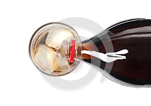 Pouring refreshing cola into glass with ice cubes on white background