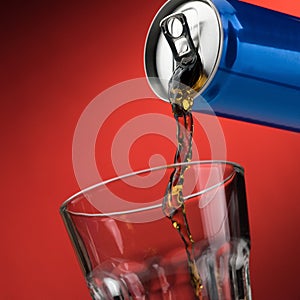 Pouring a soft drink in a glass