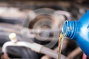 Pouring synthetic lube oil - Vehicle repairing service.