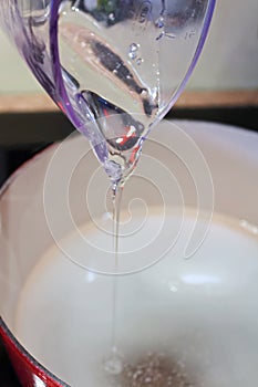 Pouring Thick Liquid Sugar from a Measuring Cup