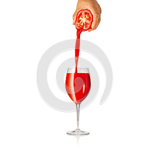 pouring tomato juice to glass isolated on white background. pouring tomato juice from fresh tomato