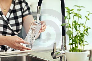 Pouring water into the bottle