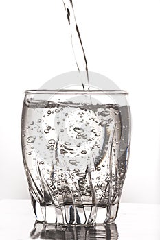 Pouring water in a glass