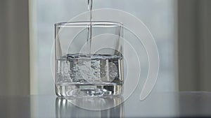 Pouring water glass of clean water, with sound, dirty polluted