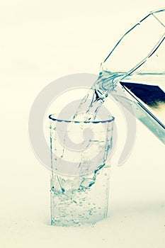Pouring water in the glass